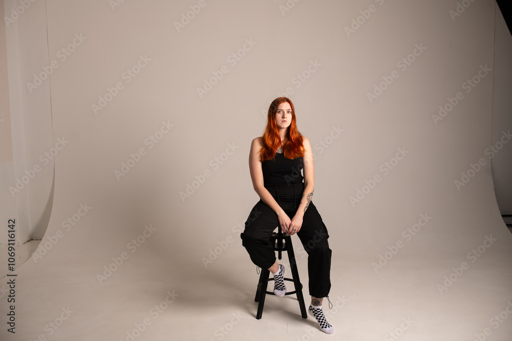 Studio portrait of a young beautiful red-haired girl. Studio portrait of a young beautiful red-haired girl.