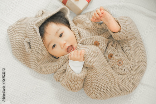 Adorable Baby in Cozy Knit Outfit with Gift Box