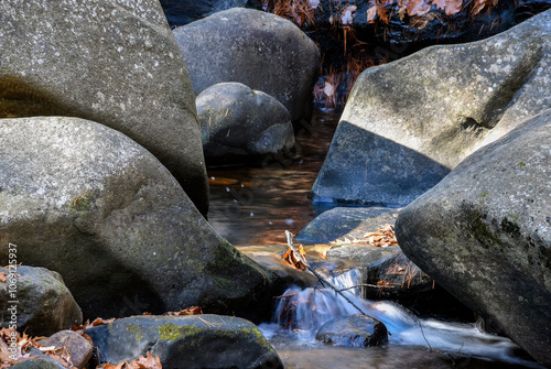 a brook cascading through the rocky terrain