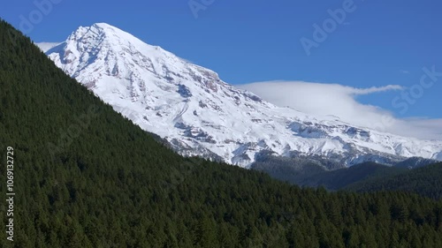 Wallpaper Mural Snow-Capped Mount Rainier Rising Above Dense Evergreen Forest Under a Clear Sky Torontodigital.ca