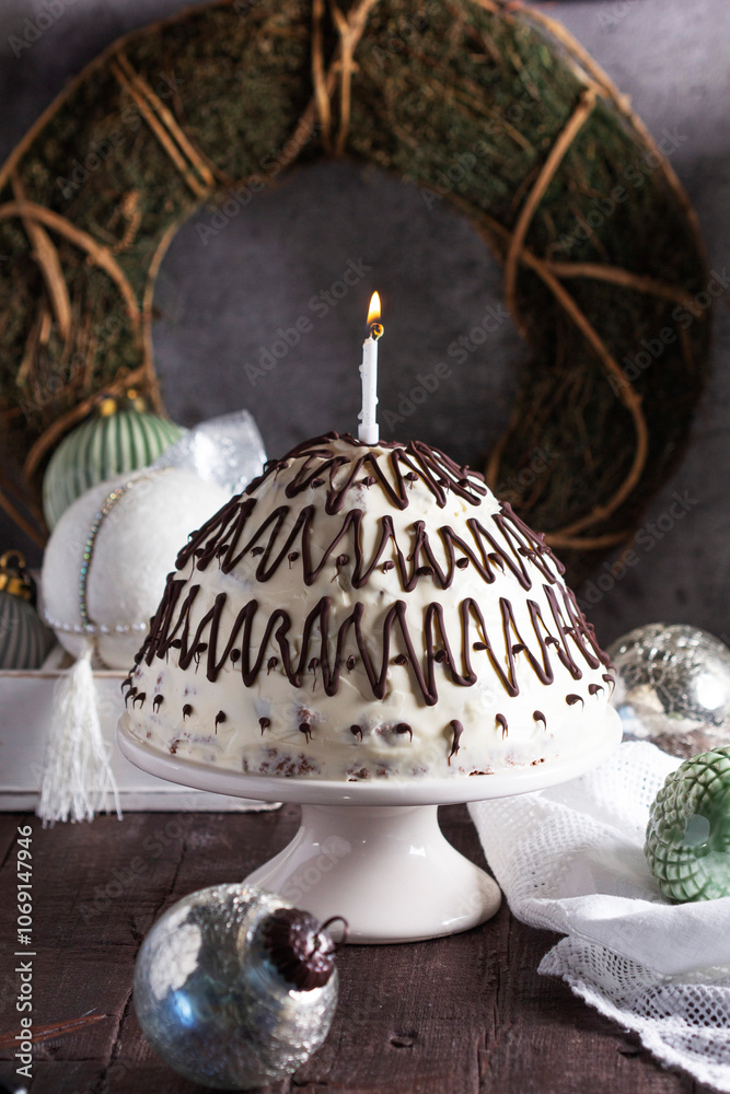 Pancho cake made of chocolate biscuit with sour cream and pineapple in New Year's or Christmas decoration. Rustic style.