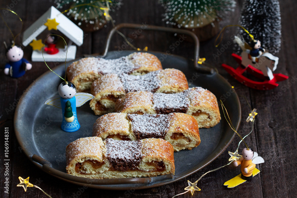 Grandfather's mustache cookies made from shortcrust pastry filled with nuts, jam and cocoa, Christmas toys and garland.