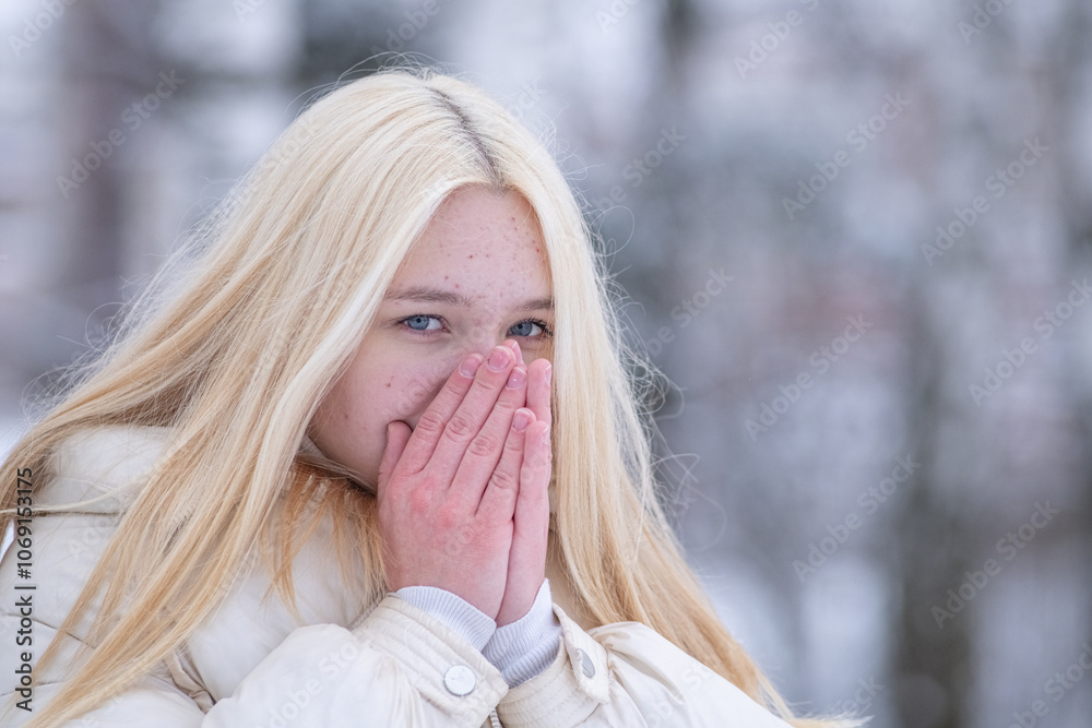 Portrait of young beautiful blonde girl outdoors in winter. Portrait of young beautiful blonde girl outdoors in winter.