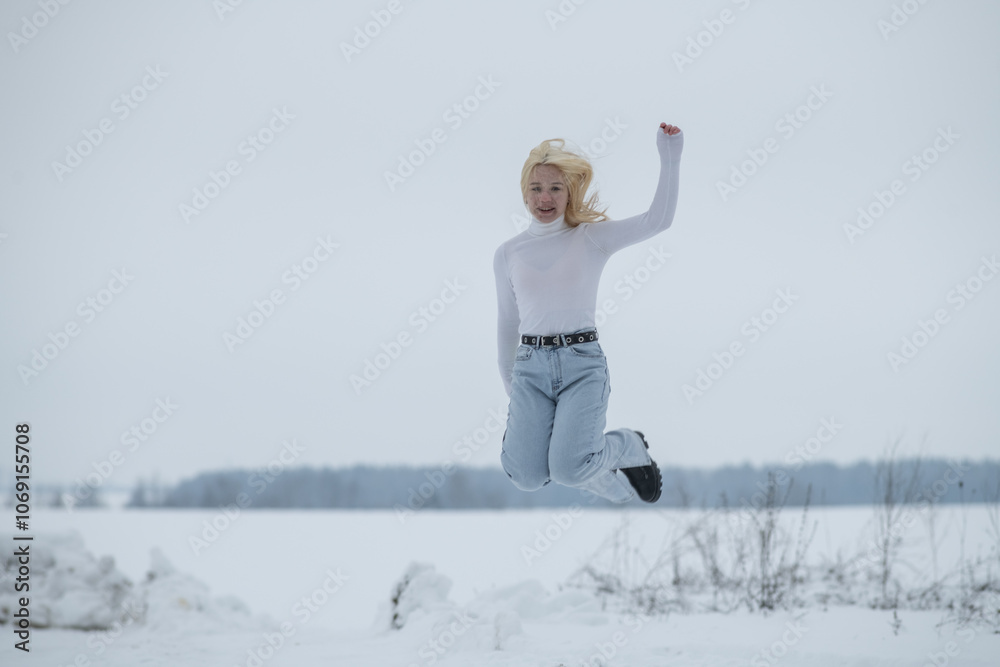 Portrait of young beautiful blonde girl outdoors in winter. Portrait of young beautiful blonde girl outdoors in winter.