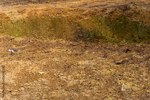 The red soil of the mountains. A background texture has been created after the rainwater mud. photo