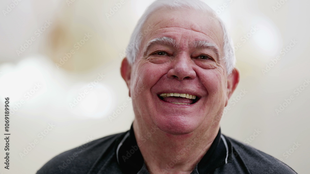 Casual Caucasian Senior Man in His 70s Laughing Spontaneously, Close-Up Smiling Face Casual Caucasian Senior Man in His 70s Laughing Spontaneously, Close-Up Smiling Face