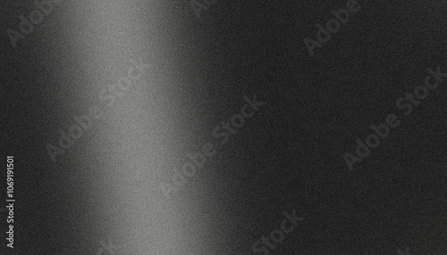 Light beam creating gradient on textured black background