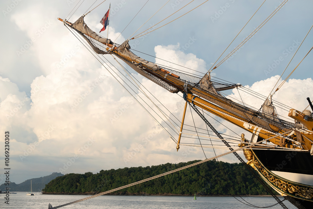 A beautiful view of the bowsprit of the Amerigo Vespucci, decorated with bronze ornaments and flags. A beautiful view of the bowsprit of the Amerigo Vespucci, decorated with bronze ornaments and flags.