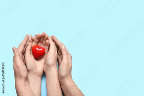 Hands of woman and child ho...