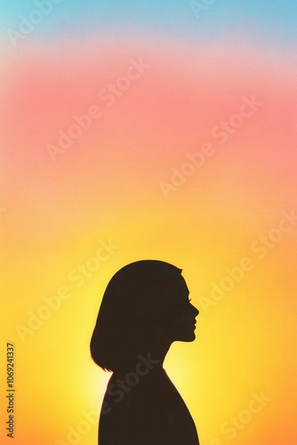 silhouette of a person against a colorful sunset sky