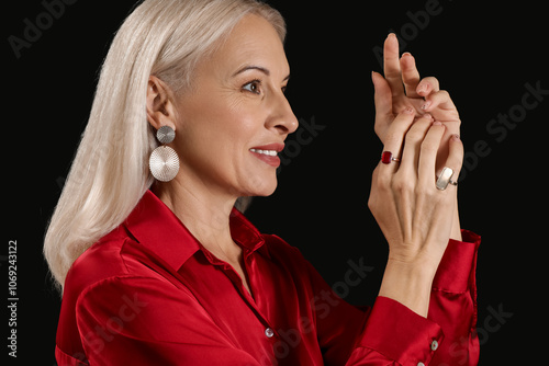 Fashionable mature woman in...
