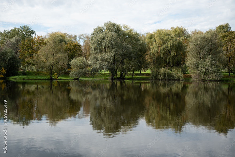 Landscape with waterline, birds, reeds and vegetation, water reflections in the Chisinau Botanical Garden Moldova Landscape with waterline, birds, reeds and vegetation, water reflections in the Chisinau Botanical Garden Moldova