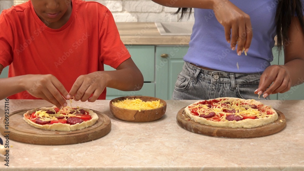 African American happy family preparing food in the kitchen. African American happy family preparing food in the kitchen.
