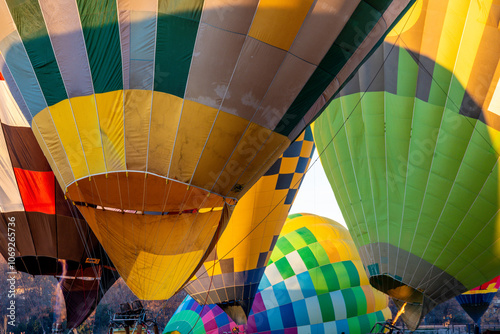 Colorful Hot Air Balloons Being Inflated for Launching photo