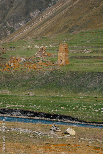 View on the ruins of an old watchtower in the almost abandonned village of Ketrisi, in the Truso Gorge, located in the Kazbegi mountains region of Georgia photo