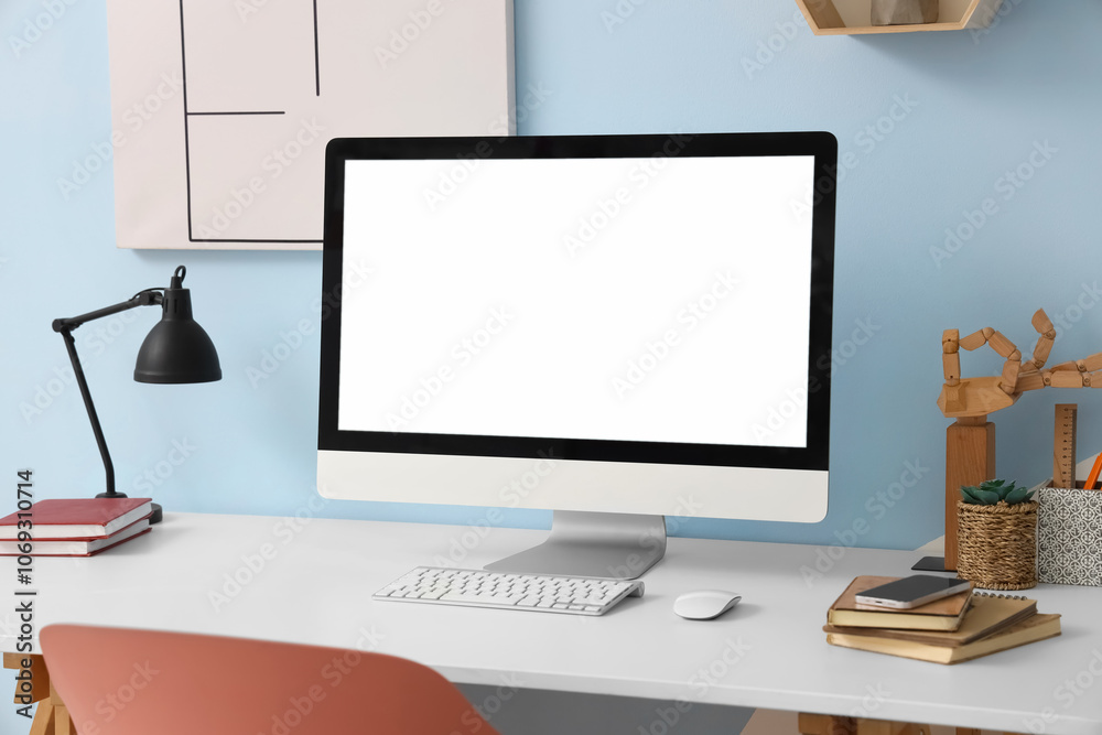 Blank computer monitor with lamp on desk in room Blank computer monitor with lamp on desk in room