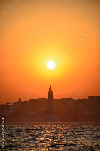 galata tower and sunset over the bosphorus, istanbul photo