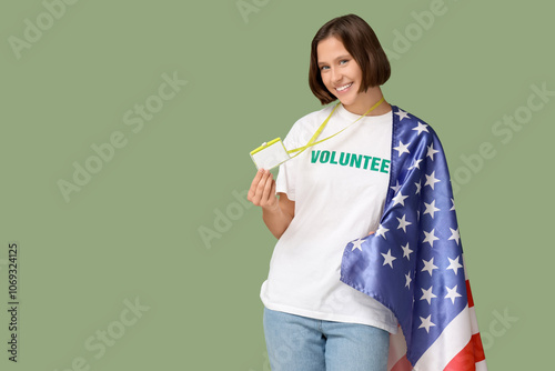 Young female volunteer with...