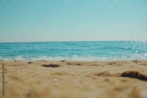 Sandy Beach with Blue Sea and Sky Background