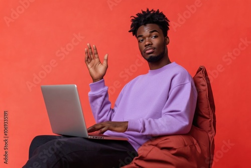 A person sitting at a desk with a laptop, likely working or studying