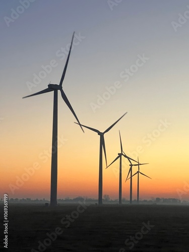 Wind turbines in a field in Indiana at sunrise in autumn.