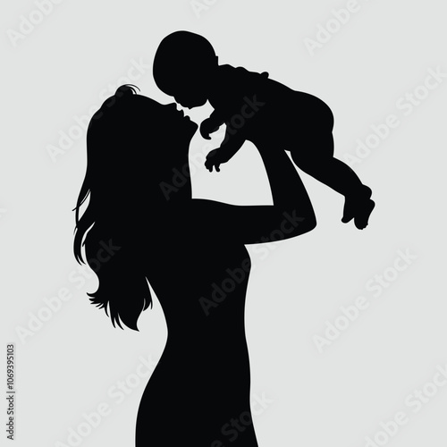 Silhouette of a woman lifting a baby, capturing a tender moment of joy and love between mother and child against a soft gray background.