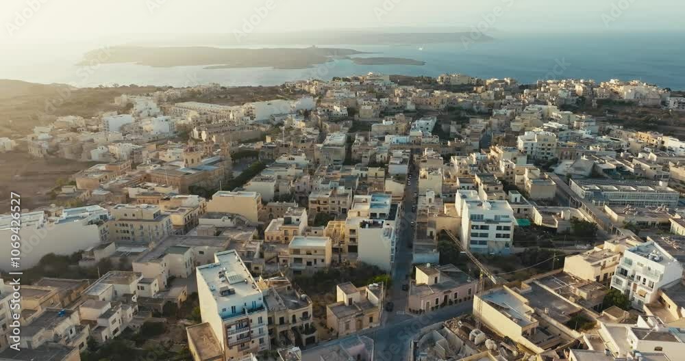 Aerial view Hondoq Qala island of Gozo Malta. Streets and architecture of the city on the shore of the Serezem Sea. High quality 4k footage Aerial view Hondoq Qala island of Gozo Malta. Streets and architecture of the city on the shore of the Serezem Sea. High quality 4k footage