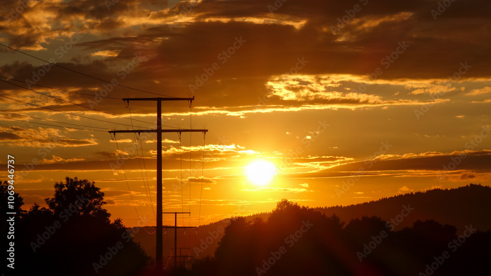 Dramatic Sunset with Silhouettes of Power Lines and Trees Dramatic Sunset with Silhouettes of Power Lines and Trees