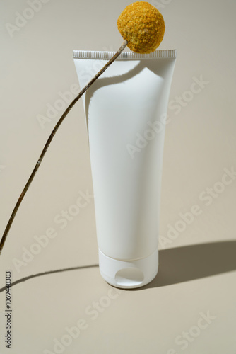 Minimalist hand cream tube with decorative flower