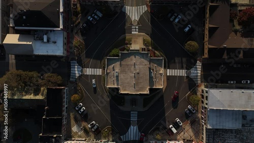 A top-down view of a roundabout in Elizabethtown, Kentucky, with traffic flowing during the early morning hours around the historic city courthouse. photo