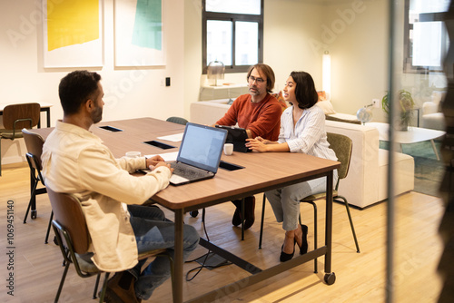 Collaborative brainstorming in a modern coworking space photo