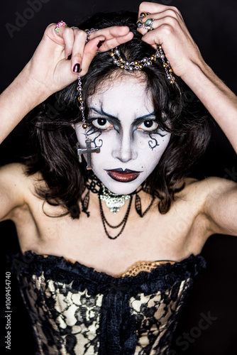 Mysterious gothic woman with dramatic makeup and jewelry