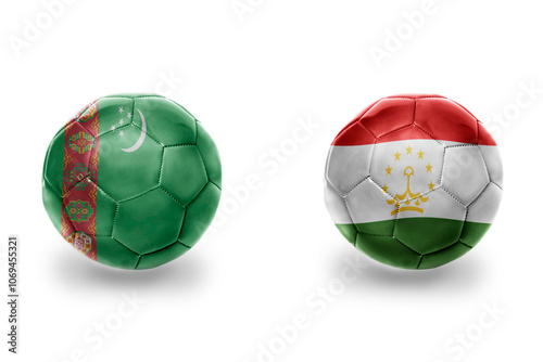 football balls with national flags of turkmenistan and tajikistan ,soccer teams. on the white background. photo