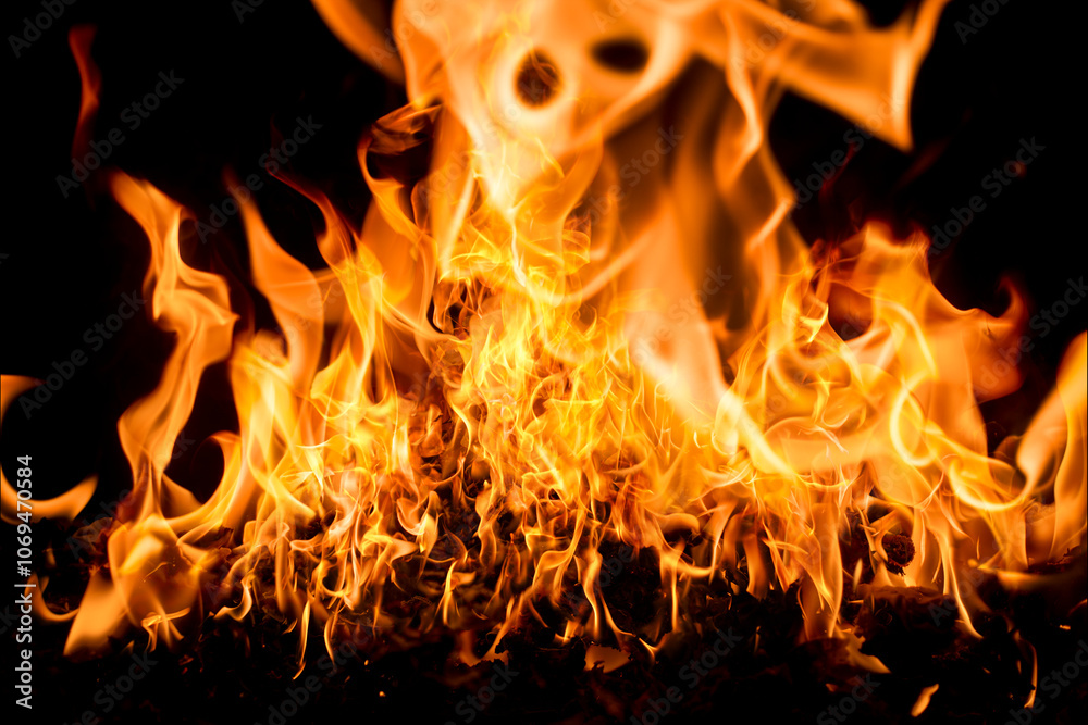Fire flame background. Hell bonfire. Texture of fire on a black background. Abstract fire flame background. Large burning fire. Fire flame background. Hell bonfire. Texture of fire on a black background. Abstract fire flame background. Large burning fire.