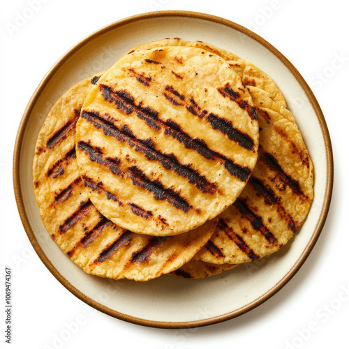 A plate of grilled corn tortillas, isolated on a white background, showcasing a traditional Mexican staple photo