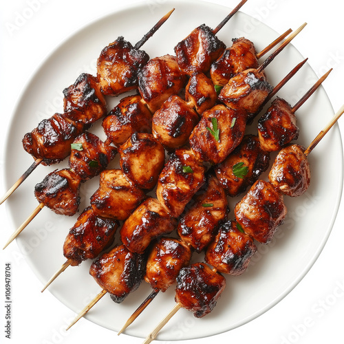 A plate of grilled chicken skewers, isolated on a white background, showcasing a flavorful and juicy dish photo