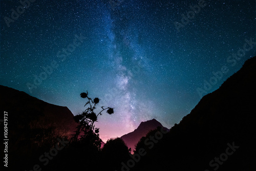 Majestic Milky Way Over Mountain Silhouette in Starry Night Sky
