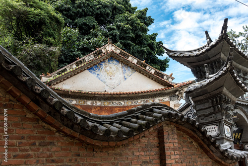 Traditional Chinese Architecture with Intricate Roof and Wall Details
