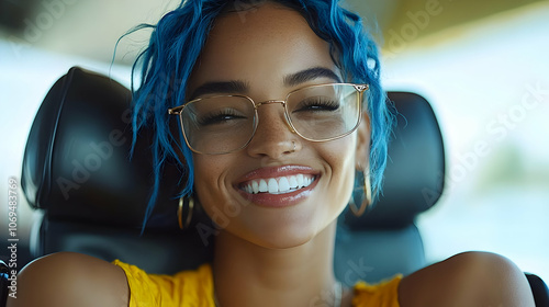 Smiling Woman with Blue Hair and Glasses - Photo