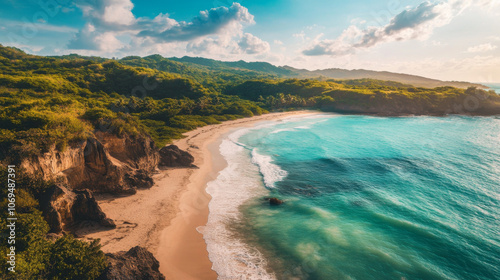 A peaceful beach with fine white sand, calm, clear water, and gentle waves, surrounded by rolling hills and sparse vegetation.