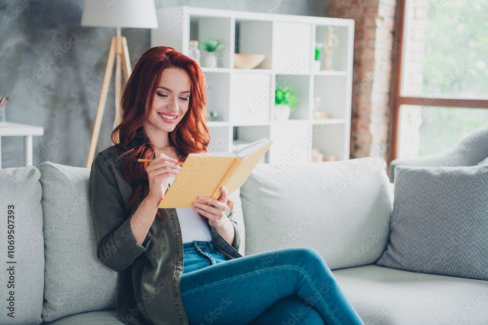 Photo of sweet pretty lady wear khaki shirt sitting sofa writing book indoors room home house Photo of sweet pretty lady wear khaki shirt sitting sofa writing book indoors room home house