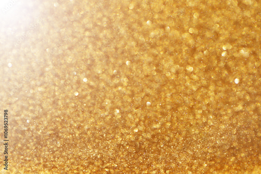 Shiny golden texture with golden bokeh. Wallpaper phone shining glitter.Glow background with highlights and golden glitter.New Year and Christmas Festive background. Shiny golden texture with golden bokeh. Wallpaper phone shining glitter.Glow background with highlights and golden glitter.New Year and Christmas Festive background.