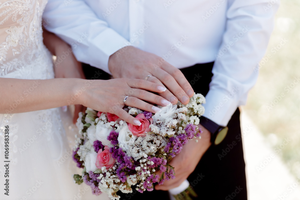 A couple in love touches each other with their hands. Love story of a young couple in love. Wedding rings on ring fingers. Concept of a marriage proposal. Starting a family. A couple in love touches each other with their hands. Love story of a young couple in love. Wedding rings on ring fingers. Concept of a marriage proposal. Starting a family.