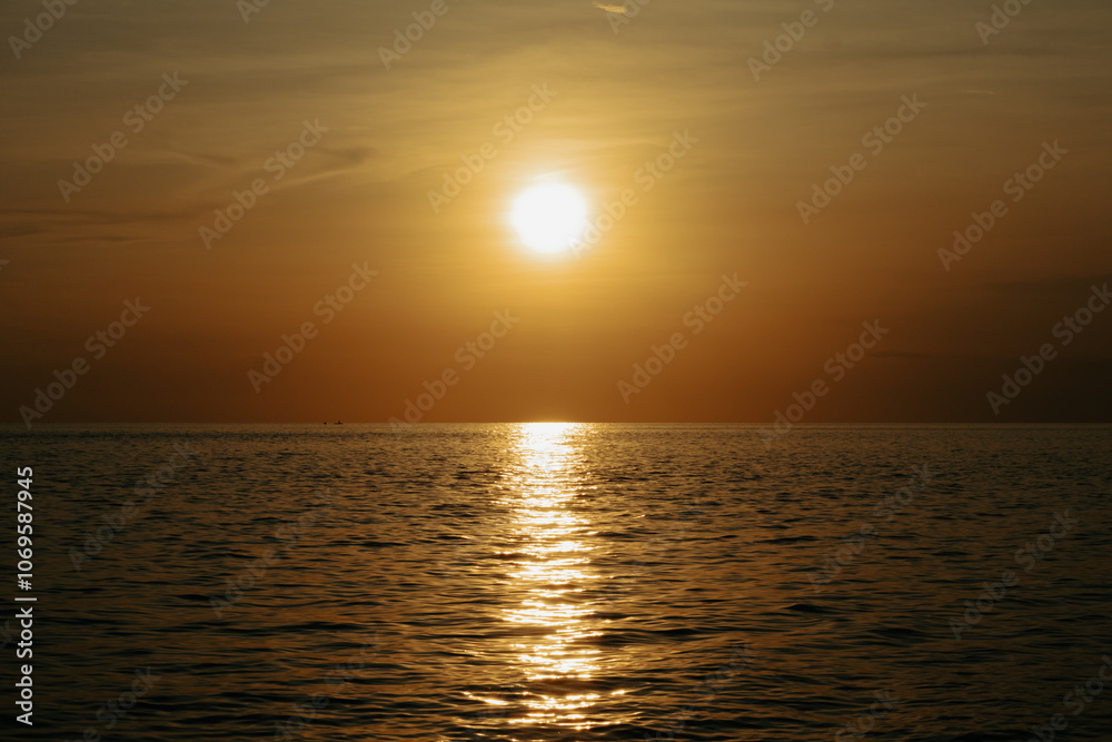 Beautiful sunset on the sea. The sun goes down over the sea. Beautiful sunset on the sea. The sun goes down over the sea.