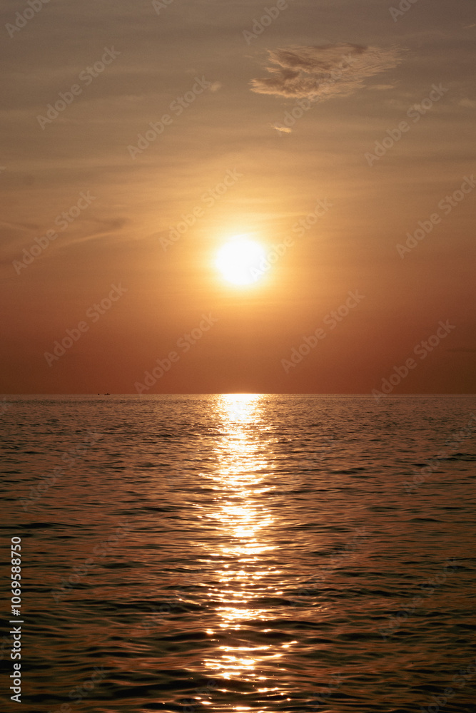Sunset over the sea. The sun is reflected in the water. Sunset over the sea. The sun is reflected in the water.