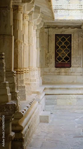 Inside the sacred Ranakpur Jain temple or Chaturmukha Dharana Vihara. Marble ancient medieval carved sculpture carvings of sacred religious place of jainism worship. Ranakpur, Rajasthan. India photo