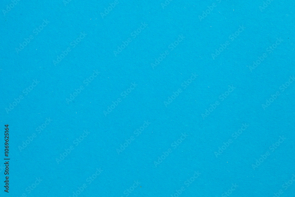 A blue background with a white dot in the middle, textured origami paper backdrop A blue background with a white dot in the middle, textured origami paper backdrop