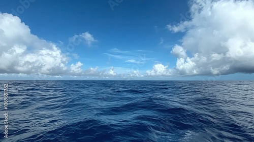 Seascape with clouds and blue sky in the ocean.