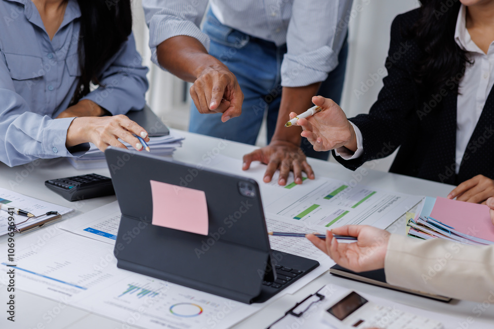 Φωτογραφία Group of confident business people point to graphs and charts to analyze market data, balance sheet, account, net profit to plan new sales strategies to increase production capacity