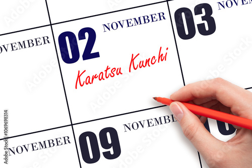 November 2. Hand writing text Karatsu Kunchi on calendar date. Save the date.